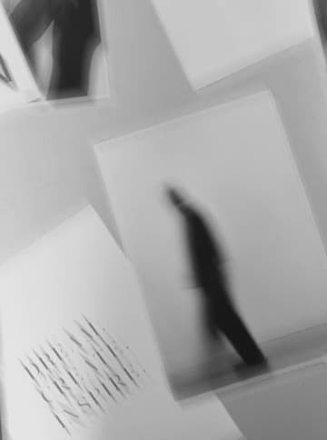 Abstract blurred figure with Dream Create Inspire text